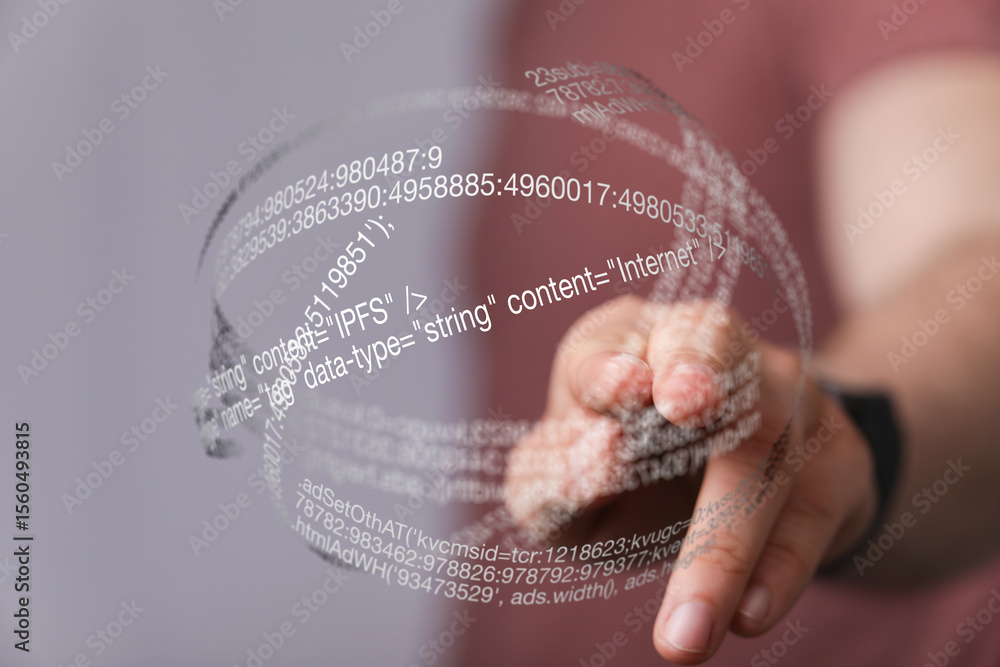 Aufkleber hand interacting with a holographic sphere displaying digital code and data.