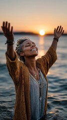 A devotee standing alone in water with eyes closed hands raised during sunrise
