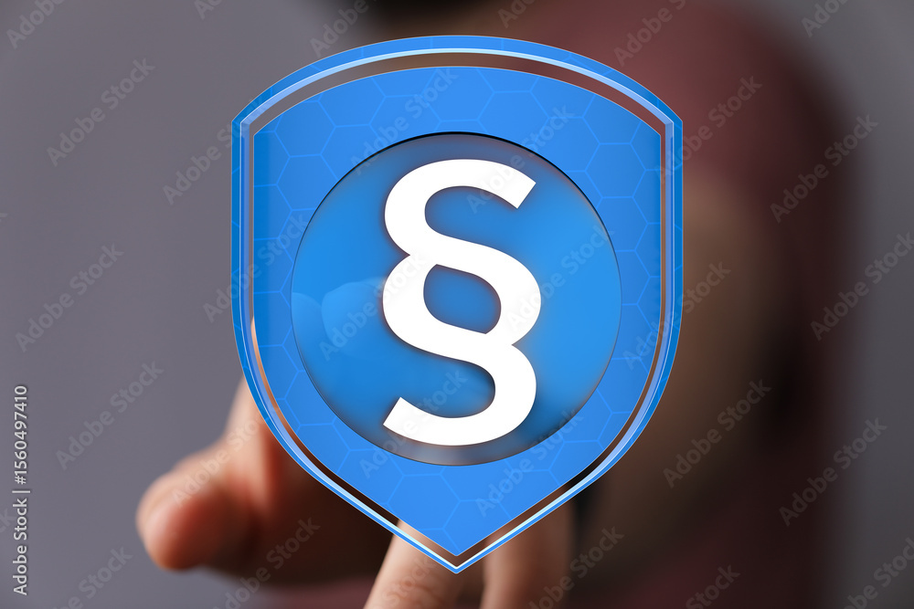 Poster abstract image of a digital shield with a paragraph symbol, representing legal protection and securi