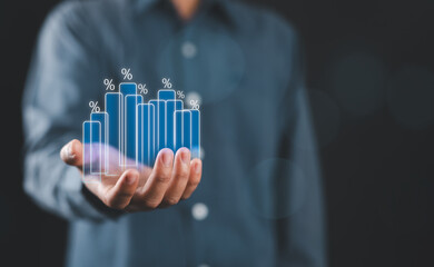 Businessman Investor, or Trader analyzing sales data and economic bar graph chart with percentage...