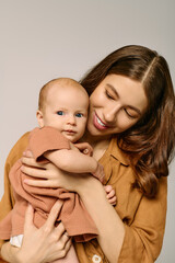 Capturing the joyful bond between a young mother and her adorable little child in a cozy setting