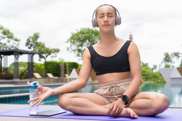 non binary gay man doing yoga exercise