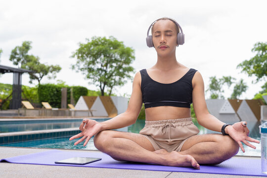 non binary gay man doing yoga exercise