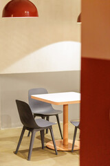 Cozy dining area with modern design and warm lighting in a stylish cafe