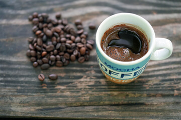 cup of coffee with beans