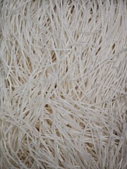 White background, tangled raw rice noodles, pattern