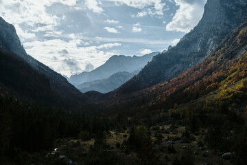Dramatic view of mountain ranges in Ropojana valley during autumn at sunset in Prokletije National...