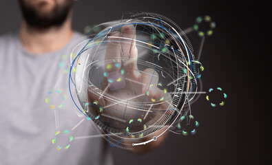 Abstract image of a person interacting with a futuristic holographic globe, representing global...