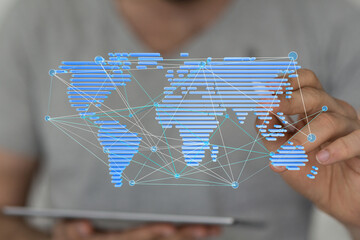 Person interacts with a digital world map showing global network connections.  Technology concept.