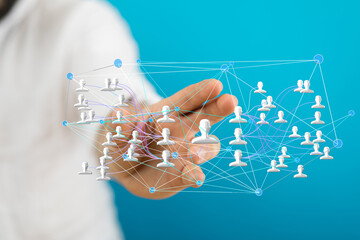 Image of a hand interacting with a network of people, symbolizing connection and collaboration.