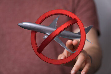 Image of a no fly zone sign with an airplane.  Perfect for travel restrictions, cancellations, and...