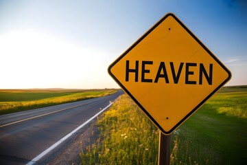 Yellow road sign reading Heaven on rural highway with green fields and blue sky - spiritual journey and destination concept