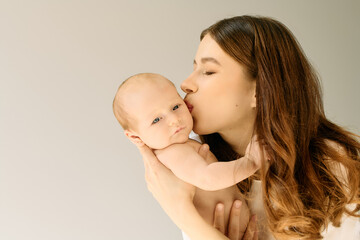 Joyful moments shared between a young mother and her adorable baby in a cozy setting