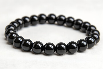 Black Onyx Beaded Bracelet on White Surface