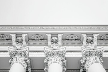 Intricate white classical architecture featuring ornate columns and detailed molding.