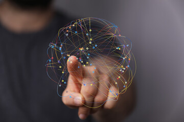 Abstract image of a hand interacting with a colorful network, representing connection and data flow.