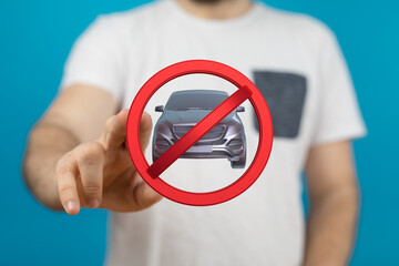 Image of a hand holding a no car sign.  Perfect for driving restrictions, parking rules, or...