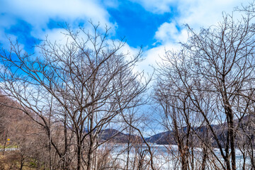 View from local road around Kanayama lake in Furano, Hokkaido, Japan, in late winter season