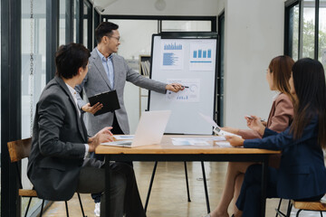 Business Meeting Presentation: A confident businessman leads a productive meeting, presenting insightful data on a whiteboard to engaged colleagues.  The atmosphere is professional and collaborative.