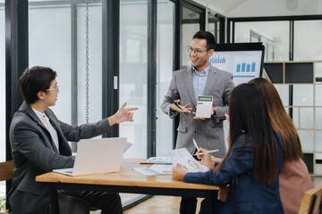 Corporate Collaboration: A dynamic meeting unfolds in a modern office, where a group of...