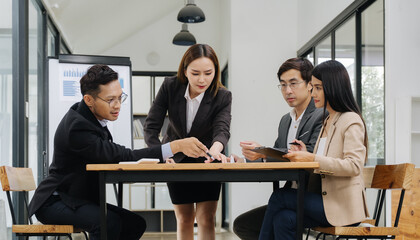 Teamwork Meeting: Business team collaborating on a project, showing engagement and focus in a...