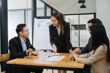 Collaborative Business Meeting: A dynamic business meeting unfolds, with professionals engaging in...