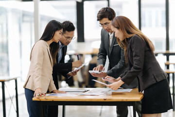 Business Meeting Dynamics: A focused team of business professionals engages in a collaborative...