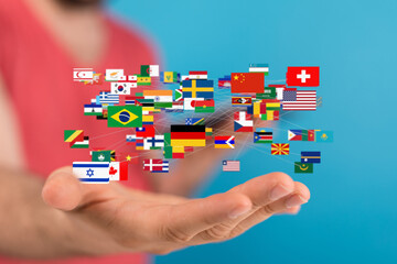 A hand holding a network of diverse country flags, symbolizing global connection and international...