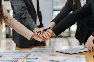 Collaboration in Focus: A close-up shot of hands joining together in a powerful display of teamwork and business collaboration