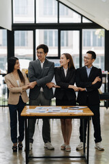 Unified Business Partners: An inclusive team, united by purpose, joins hands over a sturdy work...