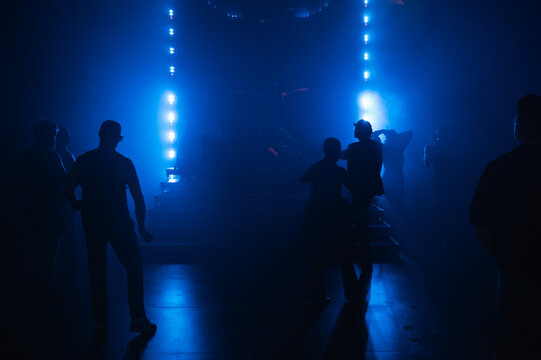 silhouette of people in a concert hall