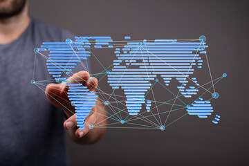Hand interacting with a digital world map, illustrating global connectivity and networking.