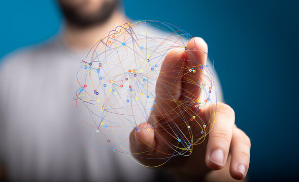 A man interacts with a digital network, visualizing connections and data flow.