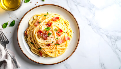 Delicious plate of creamy spaghetti carbonara with bacon and parsley on white marble table
