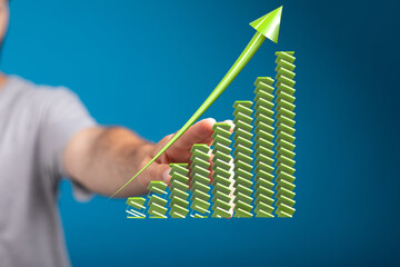 Stock photo of a hand interacting with a 3D growth chart, symbolizing business success and progress.