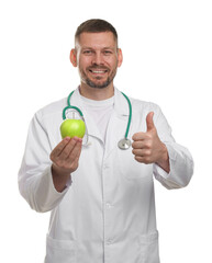 Nutritionist with green apple and stethoscope showing thumbs up on white background