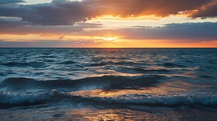 Obraz premium Stormy Cloudy Ocean Sunset with Dramatic Cumulonimbus Clouds and Turquoise Waves, Overcast Seascape Featuring Amber Glow Through Cloud Breaks and Empty Horizon