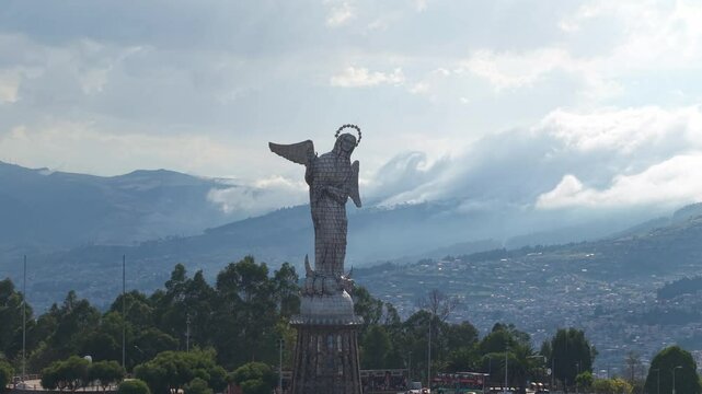 Panoramic view of the Virgin of El Panecillo statue with Quito city and the Andes mountains in the background in Ecuador Capital