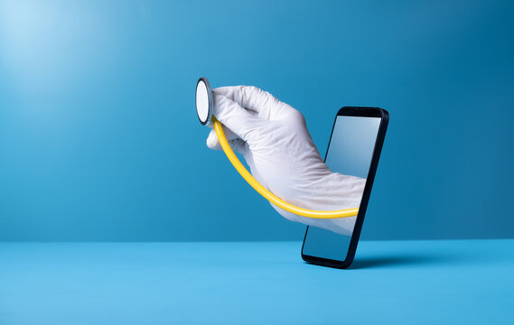 Doctor's handthrough smartphone on blue background,smartphone concept Connect to communication via online technology