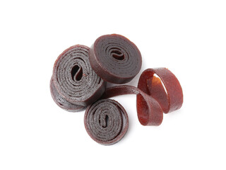 Delicious fruit leather rolls on white background, top view