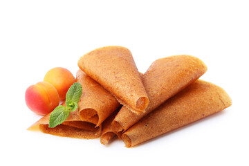 Delicious fruit leather rolls and apricots isolated on white