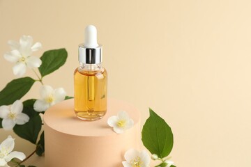 Cosmetic product and jasmine flowers on beige background, closeup. Space for text