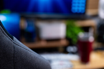 A detailed view of a modern and organized workspace, showcasing dual monitors displaying dynamic...