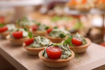 Buffet menu. Tasty stuffed tartlets on stand, closeup