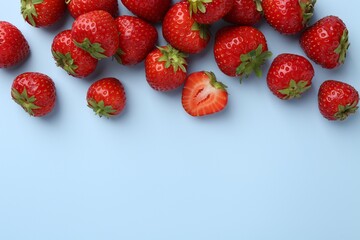 Fresh ripe strawberries on light background, flat lay. Space for text