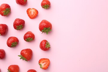 Fresh ripe strawberries on light pink background, flat lay. Space for text
