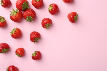 Fresh ripe strawberries on light pink background, flat lay. Space for text