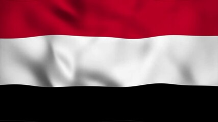 The fluttering Yemeni national flag is a patriotic symbol, fluttering gently with drapery like it's being blown up