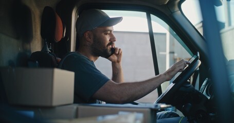 Professional Product Supplier in Truck Talking by Mobile Phone with Customer, Filling Out Papers, Using Tablet Computer. Driver Working in Express Delivery Service of Online Orders, E-Commerce Goods.