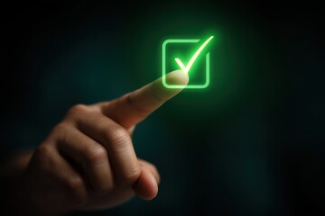 Hand touching a glowing green check mark